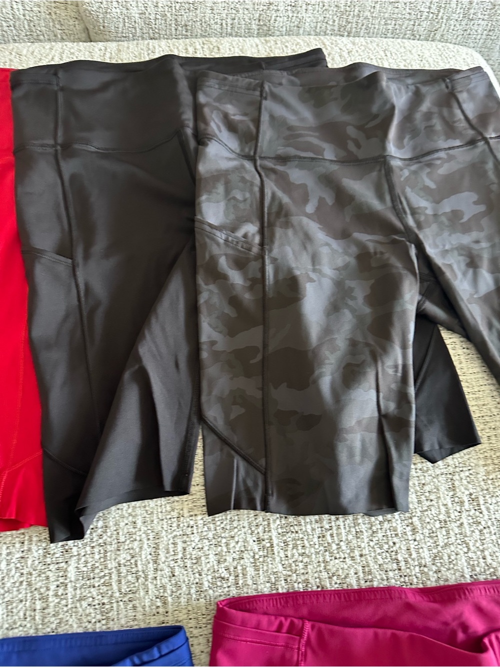 4 pairs of Lululemon. Bike shorts, 8”. Red, black, camo, and flower.